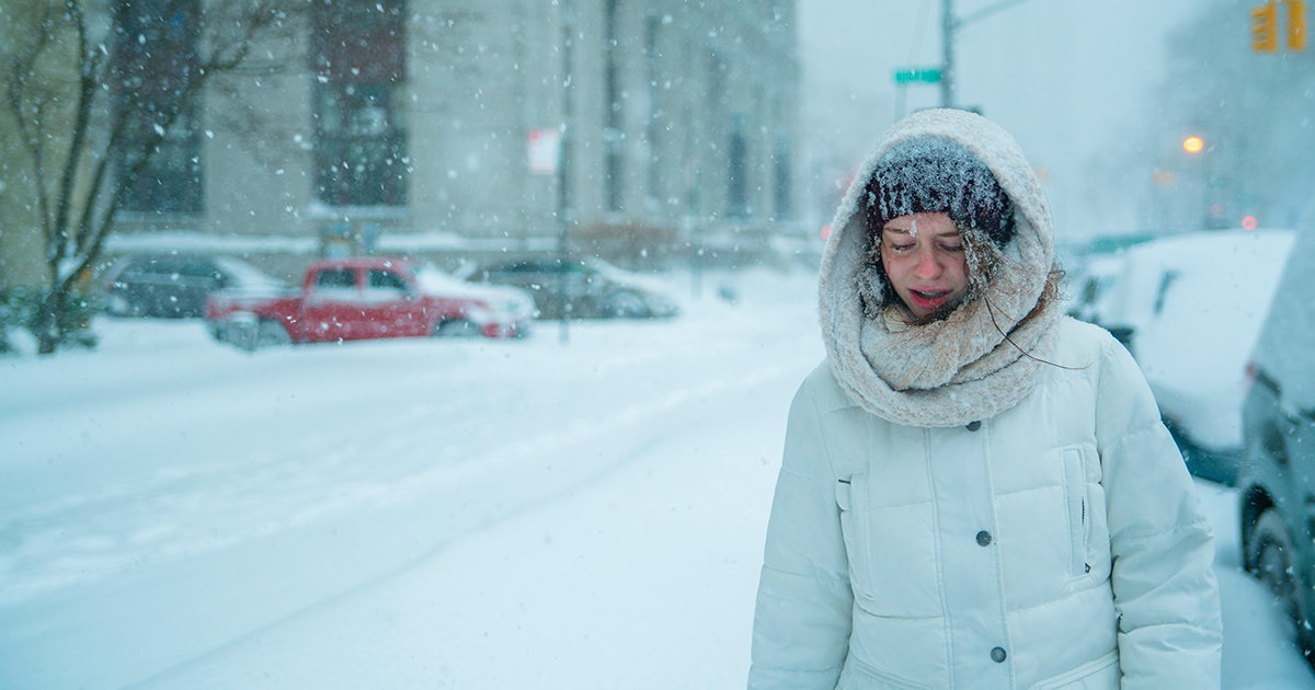 woman_walking_blizzard woman walking in a blizzard